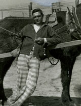 Prisoner in front of mule cart