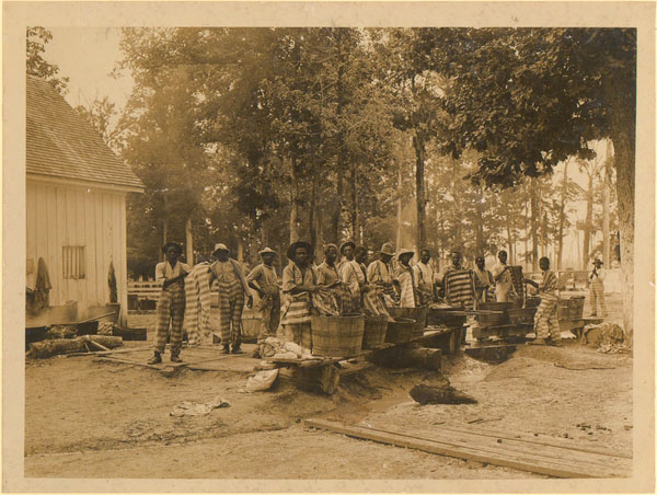 Male prisoners washing clothes