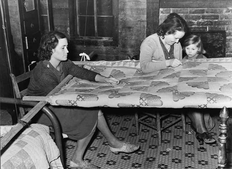 Quilting in a sharecropper's home