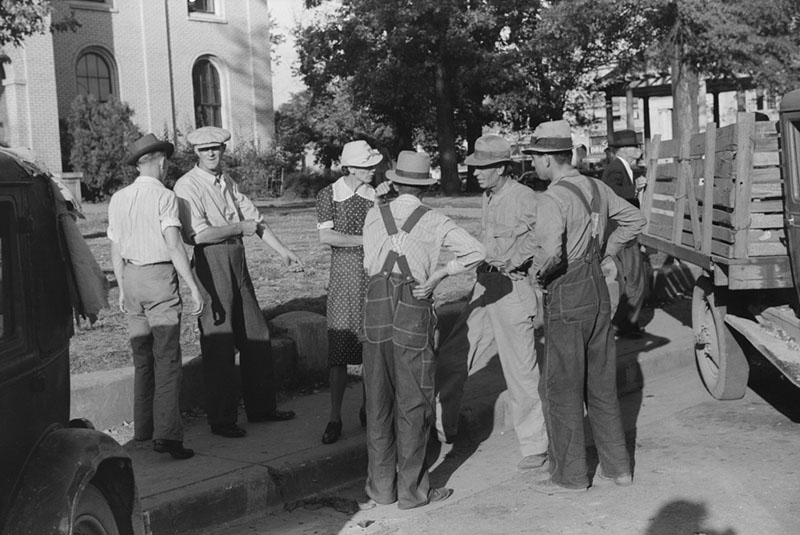 People visiting in front of courthouse